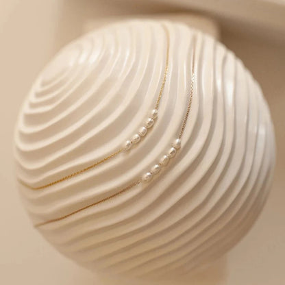 The Odette Pearl Arc Necklace